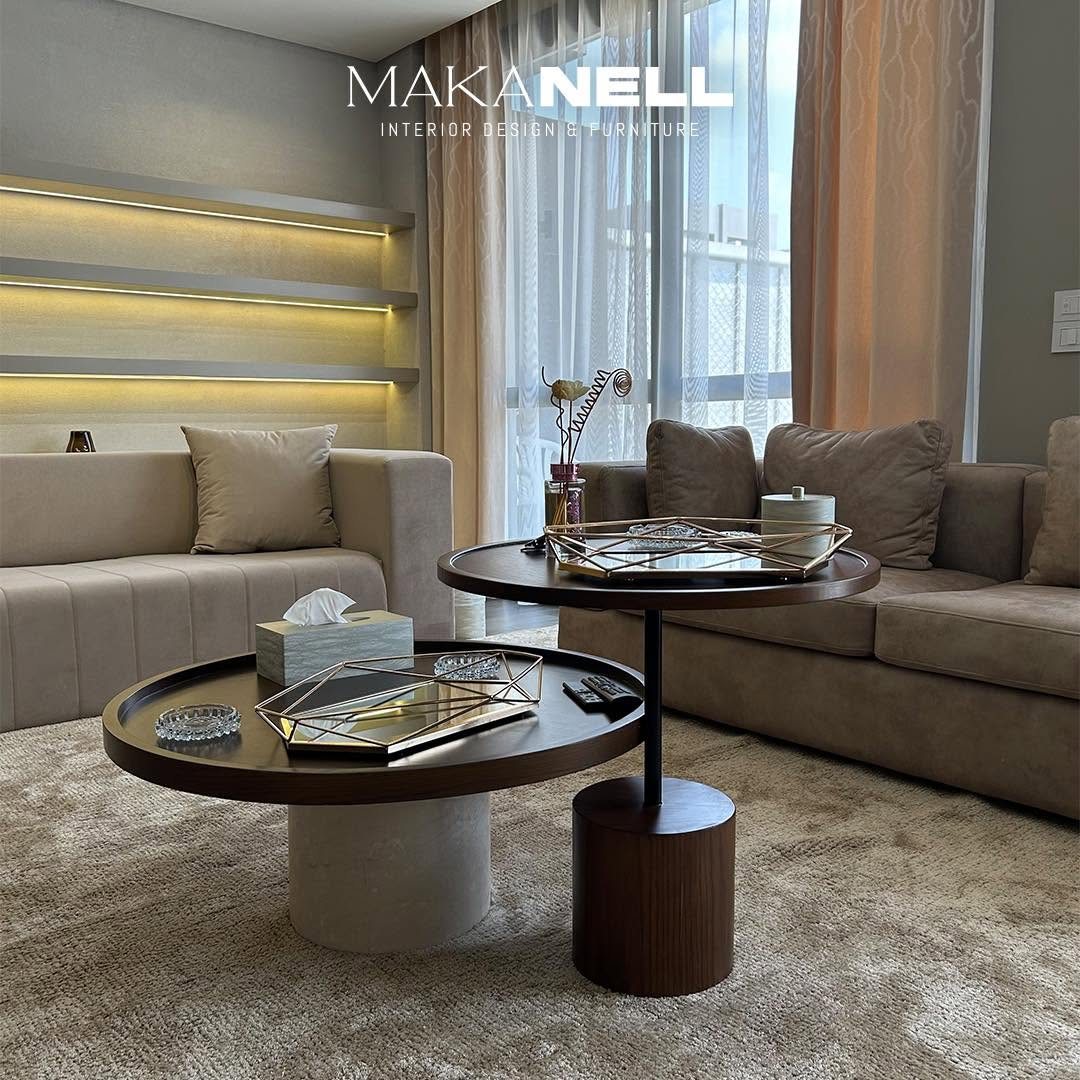 Round walnut and marble coffee tables in a living room